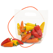 A clear plastic bag filled with assorted small bell peppers, including red, yellow, and orange ones. A few peppers are placed outside the bag on the surface. GREENHOUSE Goodness